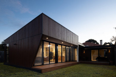 Modern brown house exterior in Melbourne with wood siding.