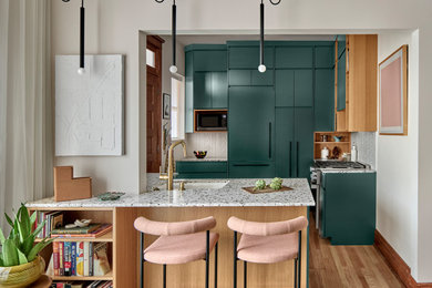 Inspiration for a small eclectic brown floor and medium tone wood floor enclosed kitchen remodel in Chicago with an undermount sink, flat-panel cabinets, green cabinets, terrazzo countertops, white backsplash, porcelain backsplash, stainless steel appliances and multicolored countertops