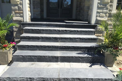 Design ideas for a mid-sized traditional front yard driveway in Toronto.