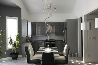 Inspiration for a large contemporary marble floor and gray floor great room remodel in Toronto with white walls and no fireplace