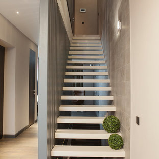 Medium sized contemporary acrylic straight staircase in Moscow with open risers.