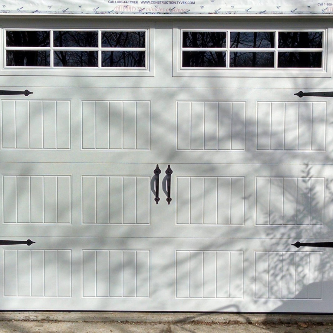 White Overhead Garage Door With Rectangular Windows