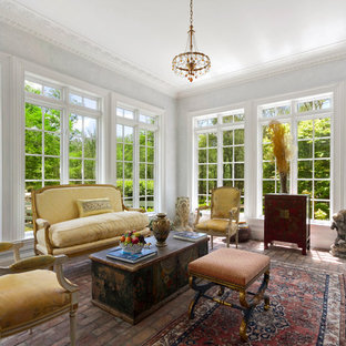Sunroom - large traditional brick floor and red floor sunroom idea in New York with a standard ceiling and no fireplace