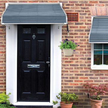 Slate Blue Aluminum Door Canopy on a brick house