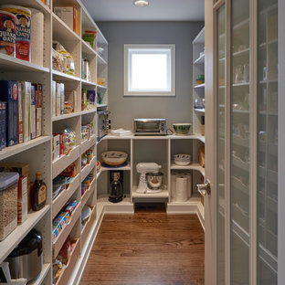 Large traditional kitchen pantry designs - Inspiration for a large timeless galley dark wood floor kitchen pantry remodel in Seattle with shaker cabinets, white cabinets, gray backsplash and an island