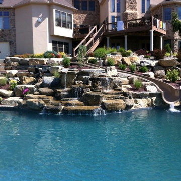 North Whitehall custom pool with boulder waterfall, slide, & separate spa