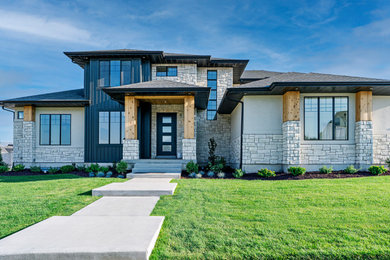 Minimalist gray two-story mixed siding house exterior photo in Salt Lake City with a shingle roof and a black roof