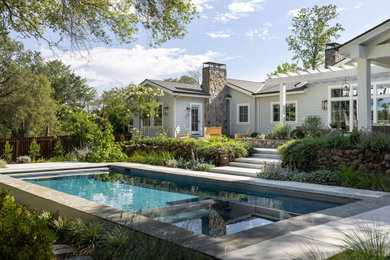 Hot tub - mid-sized transitional backyard concrete and rectangular lap hot tub idea in Sacramento