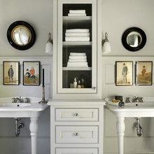 linen tower between sinks