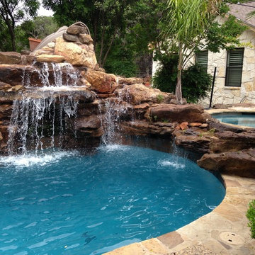 Pool with Separate Spa and Moss Rock Design