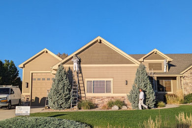 Example of a transitional exterior home design in Denver