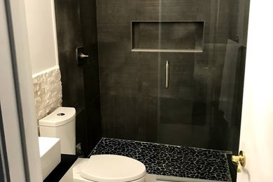 Design ideas for a mid-sized 3/4 bathroom in Other with white cabinets, an alcove shower, a two-piece toilet, gray tile, porcelain tile, white walls, porcelain floors, a vessel sink, marble benchtops, multi-coloured floor, a hinged shower door and white benchtops.
