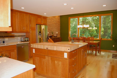 Kitchen - large contemporary kitchen idea in Other with medium tone wood cabinets, white backsplash, stainless steel appliances and an island