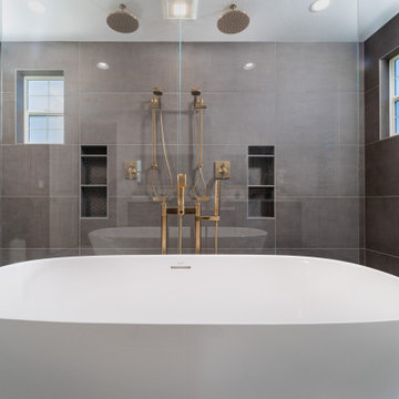 Elegant master bathroom with large format tile