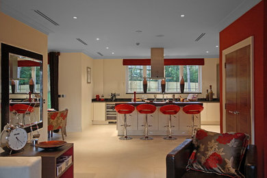 This is an example of a large contemporary eat-in kitchen in London with a peninsula.