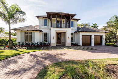 Island style home design photo in Miami