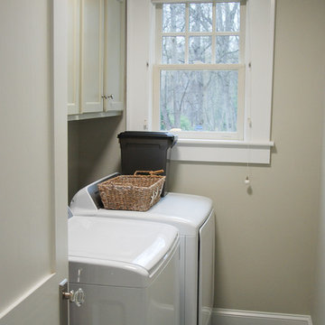Former bathroom becomes main floor laundry room.