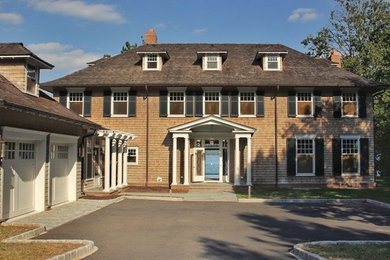 Large traditional gray three-story wood house exterior idea in New York with a hip roof and a shingle roof