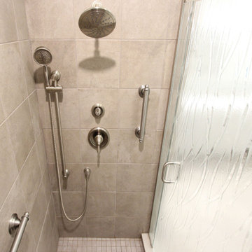 Warm Gray Vanity with Maple Truffle Accent Linen Cabinet and Tiled Shower