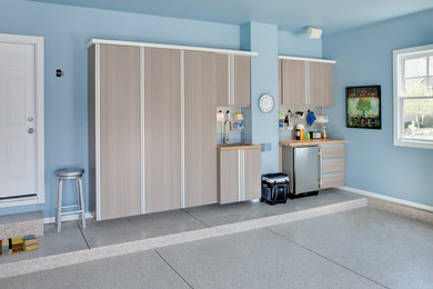 Mid-sized transitional attached two-car garage workshop photo in Charleston