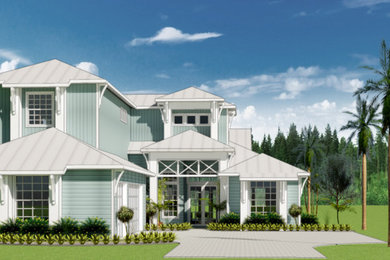 Photo of a large beach style two-storey house exterior in Orlando with concrete fiberboard siding, a hip roof, a metal roof and board and batten siding.