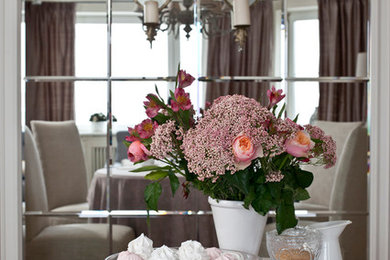 Dining room - mid-sized light wood floor dining room idea in Moscow with white walls