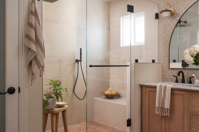 Bathroom - transitional beige tile brown floor and double-sink bathroom idea in San Francisco with shaker cabinets, medium tone wood cabinets, beige walls, an undermount sink, a hinged shower door, gray countertops and a freestanding vanity