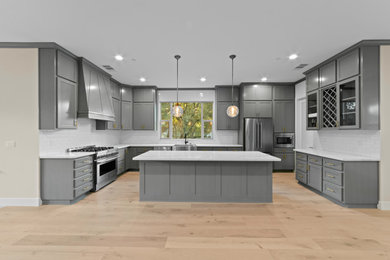 This is an example of a mid-sized transitional kitchen in Sacramento.