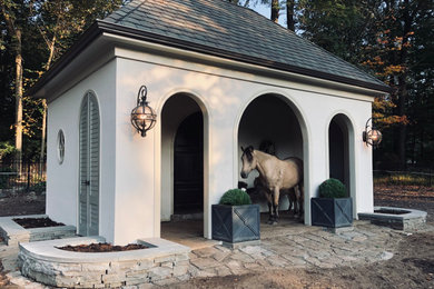 Example of a mid-sized trendy detached barn design in New York