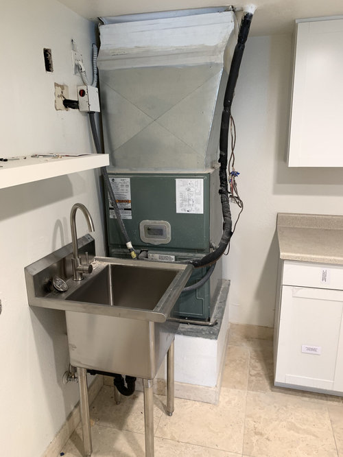 How can I hide this unseemly HVAC unit in my laundry room?