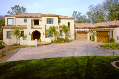 Huge tuscan beige two-story stucco gable roof photo in Sacramento