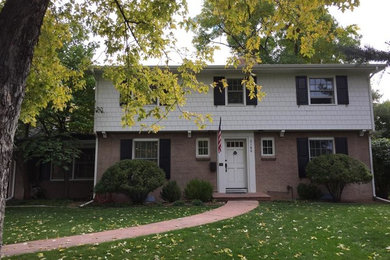 Inspiration for a mid-sized white two-story mixed siding exterior home remodel in Denver
