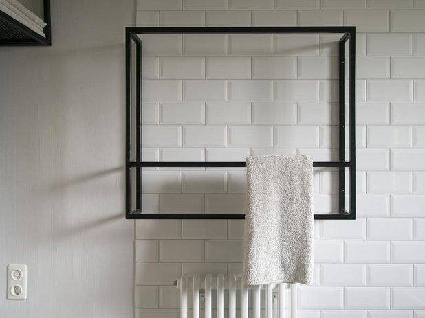 Schwarzstahl, Metro-Fliesen und Terrazzo für zwei Wiener Bäder