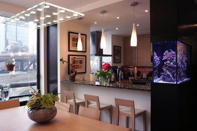 Inspiration for a mid-sized contemporary u-shaped painted wood floor and brown floor enclosed kitchen remodel in Other with an undermount sink, flat-panel cabinets, light wood cabinets, granite countertops, metallic backsplash, glass tile backsplash, stainless steel appliances and brown countertops