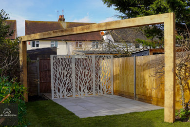 Design ideas for a medium sized contemporary back garden fence in London.