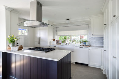 Kitchen - large ceramic tile, gray floor and wood ceiling kitchen idea in Los Angeles with gray backsplash, ceramic backsplash, stainless steel appliances and a peninsula