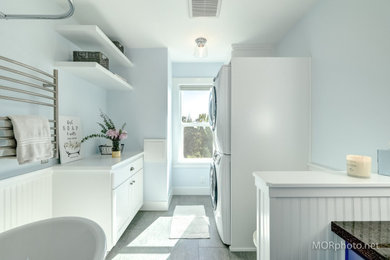 Bathroom - mid-sized country vinyl floor, gray floor, single-sink and wainscoting bathroom idea in Portland with shaker cabinets, white cabinets, a bidet, blue walls, an undermount sink, granite countertops, white countertops and a built-in vanity