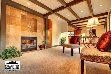 This is an example of a large traditional formal enclosed living room in Seattle with beige walls, carpet, a standard fireplace, a metal fireplace surround and no tv.