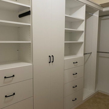 Walk in Closet with custom cabinet