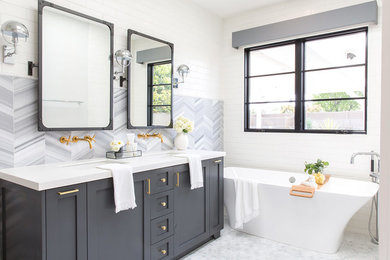 Design ideas for a large country master bathroom in Los Angeles with recessed-panel cabinets, grey cabinets, a drop-in tub, an open shower, gray tile, ceramic tile, white walls, white floor and an open shower.