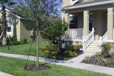 Design ideas for a mid-sized full sun front yard concrete paver landscaping in Orlando.