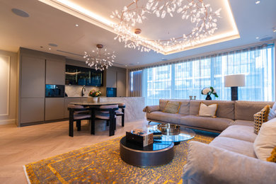 Inspiration for a small modern open plan living room in London with white walls and medium hardwood flooring.