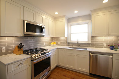 This is an example of a small transitional kitchen in New York.