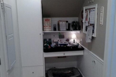 Inspiration for a small built-in desk carpeted study room remodel in Other with gray walls