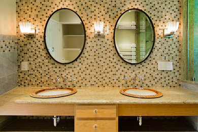 Inspiration for a mid-sized eclectic master beige tile, brown tile, multicolored tile, white tile and mosaic tile alcove shower remodel in Boston with flat-panel cabinets, light wood cabinets, a two-piece toilet, beige walls and a drop-in sink