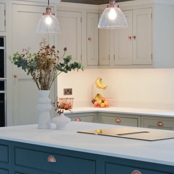 Large open-plan modern kitchen with full length handmade cupboards