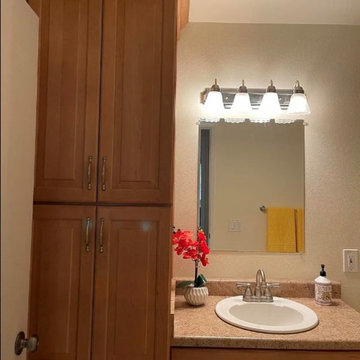 Before: Hall Bath with Full-Height Cabinet and No Laundry Hookups – Mission Vall