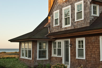Ornate brown two-story wood gable roof photo in Providence