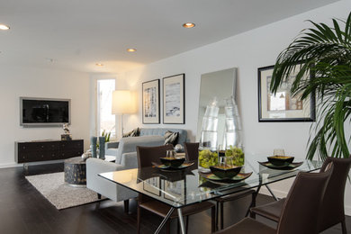 Great room - mid-sized dark wood floor great room idea in San Francisco with white walls and no fireplace