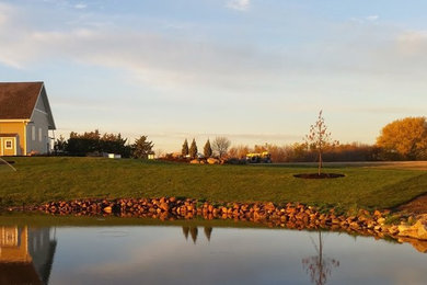 Inspiration for a large traditional full sun backyard water fountain landscape in Other.
